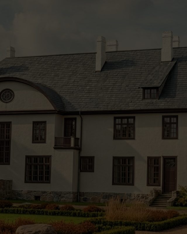 The garden front of the manor house above its lawn